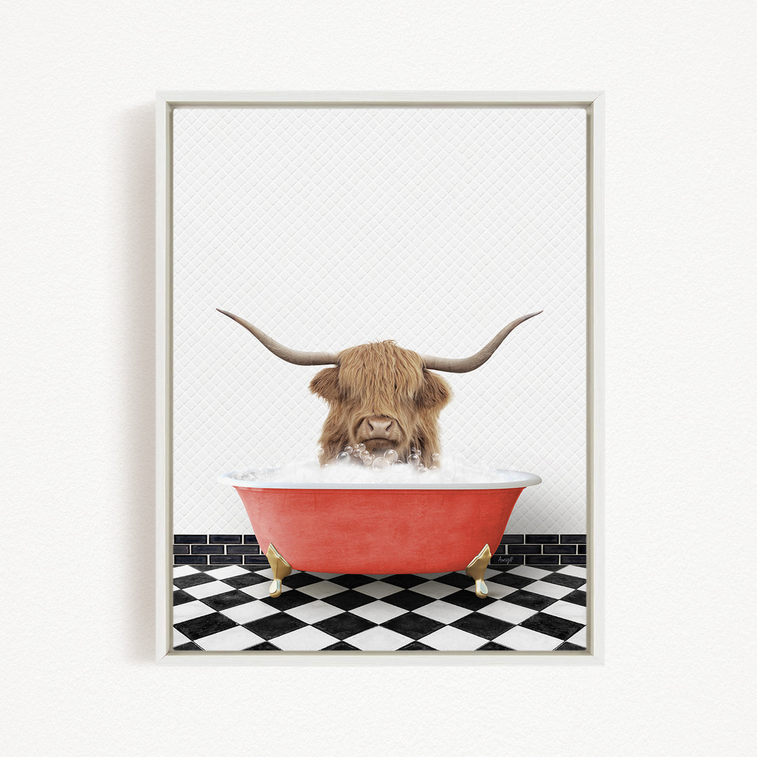 A Highland cow with long horns is sitting in a red bathtub filled with water, creating a whimsical and playful scene.