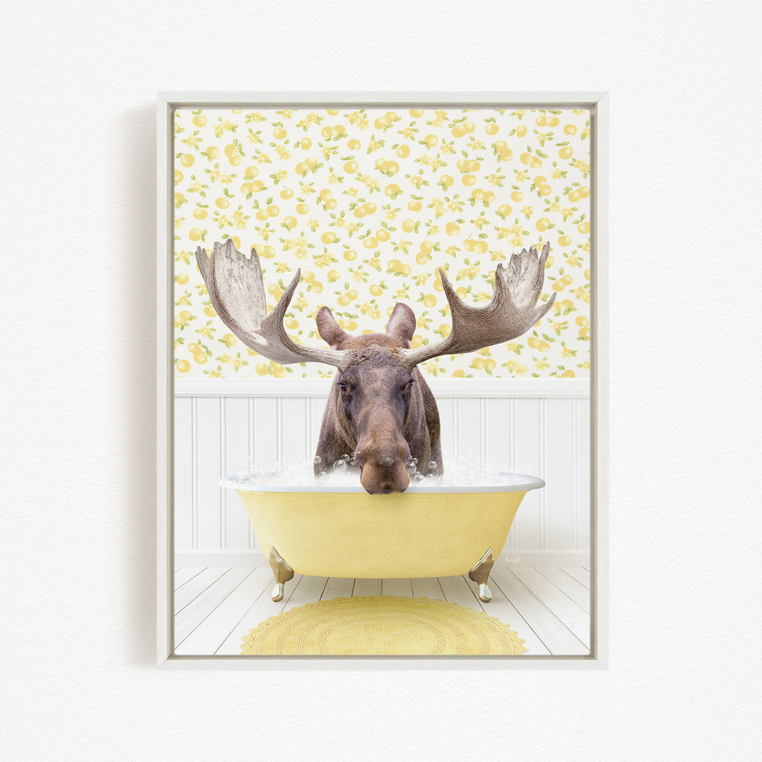 A moose with large antlers is sitting in a yellow bathtub, surrounded by a yellow floral pattern on the wall behind it.