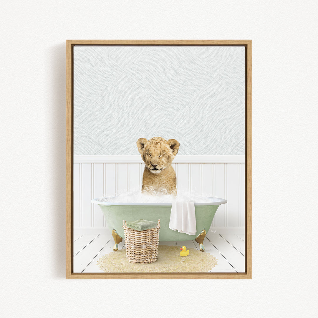 A young lion cub sitting in a green bathtub filled with bubbles, surrounded by rubber ducks and a basket.
