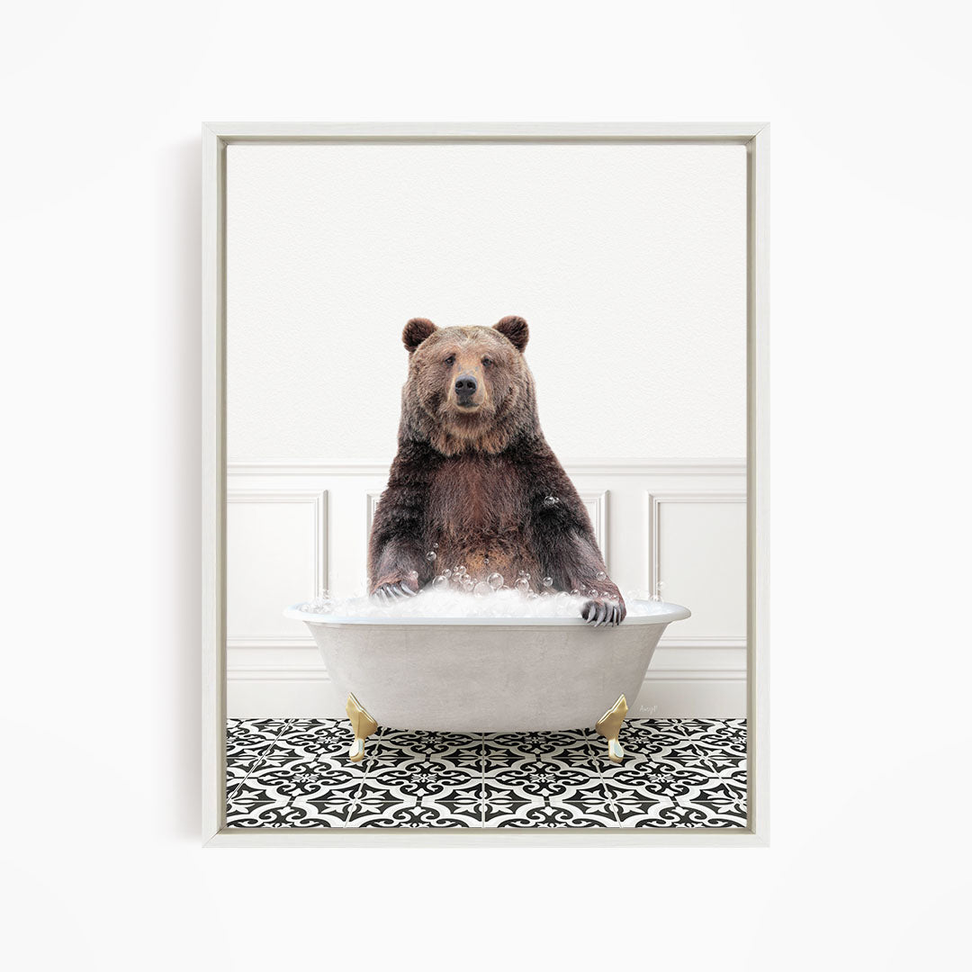 A brown bear sitting in a white bathtub filled with water, surrounded by a black and white patterned floor.