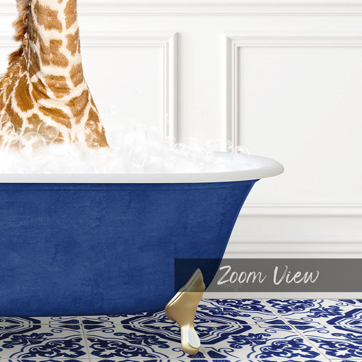 A giraffe standing in a blue bathtub filled with bubbles, with a white wall and a patterned tile floor in the background.