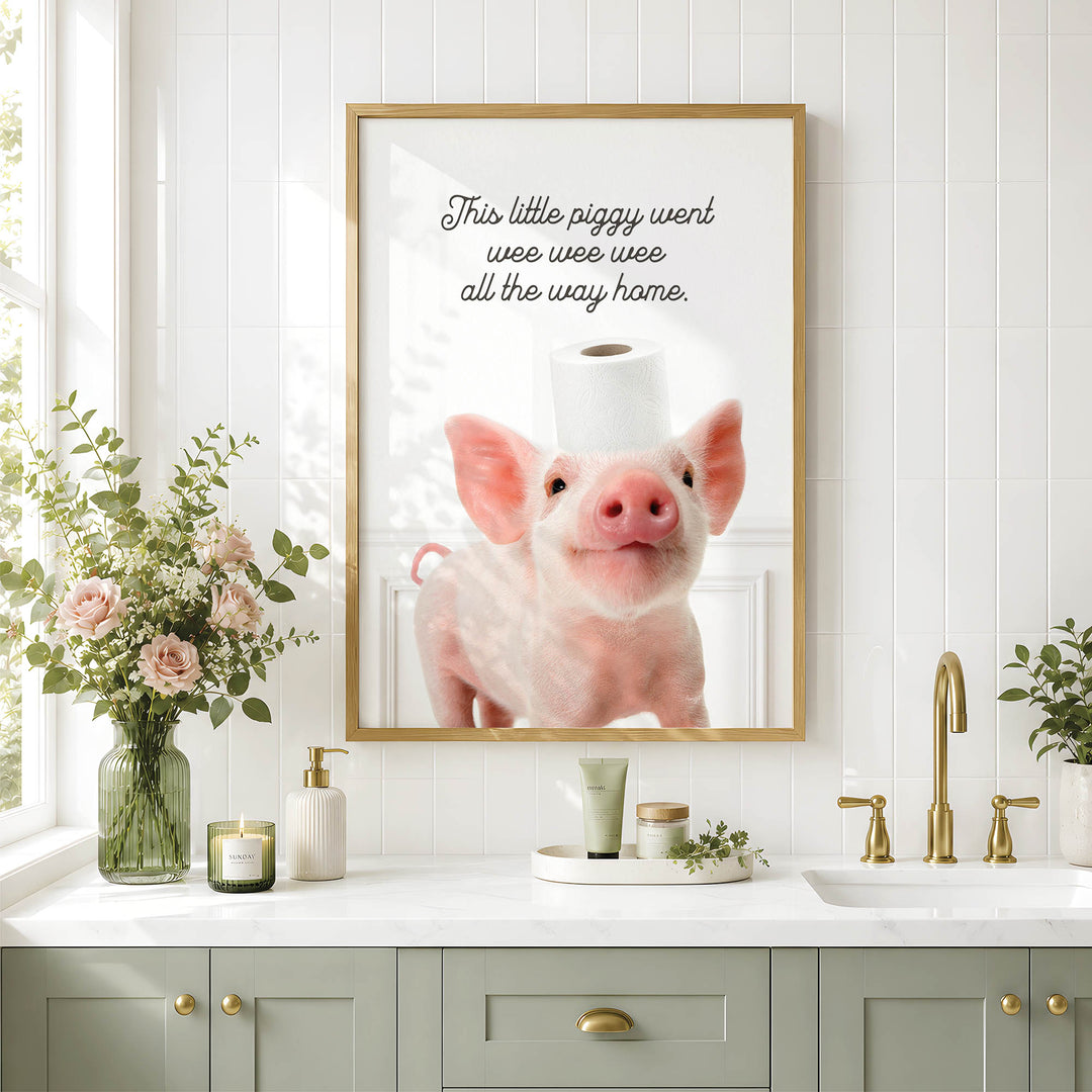 a bathroom scene with a framed photo of a pig on the wall, a vase of flowers, and a sink with a green cabinet below it.