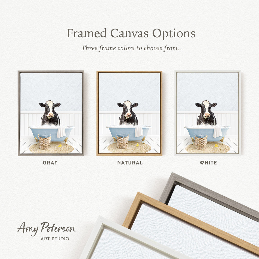 three framed canvas options featuring a cow sitting in a bathtub, with each option having a different frame color.