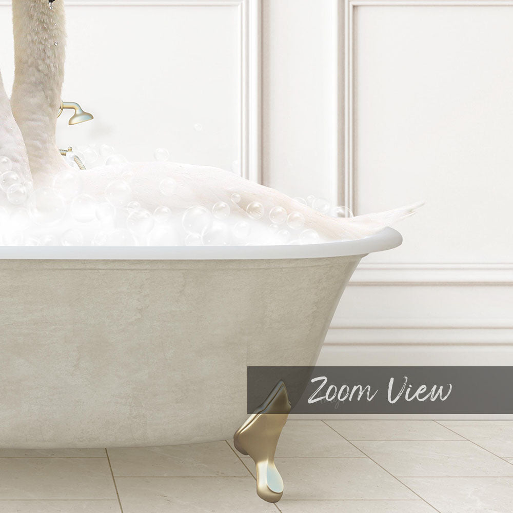 A white bathtub filled with bubbles, with a gold faucet and a gold bathtub brush.