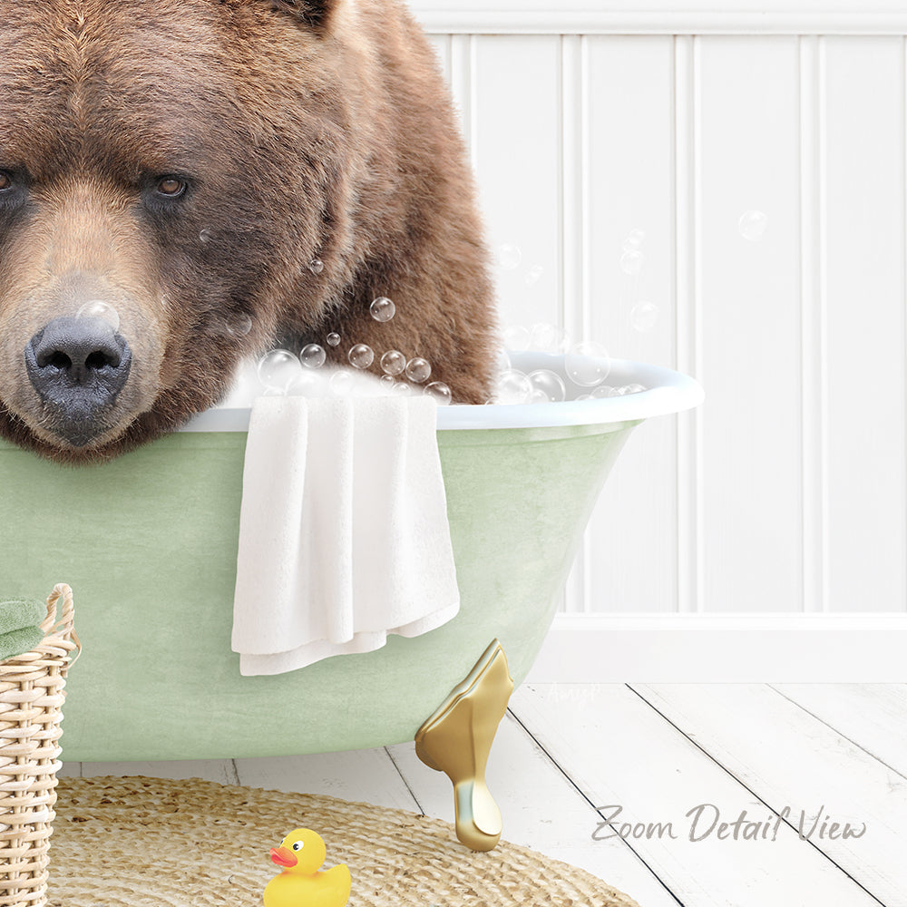 A large brown bear is sitting in a green bathtub filled with bubbles, surrounded by a yellow rubber duck and a white towel.