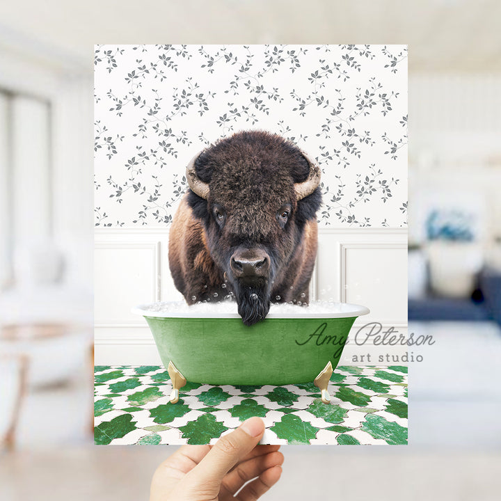 a bison sticking its head in a green bathtub