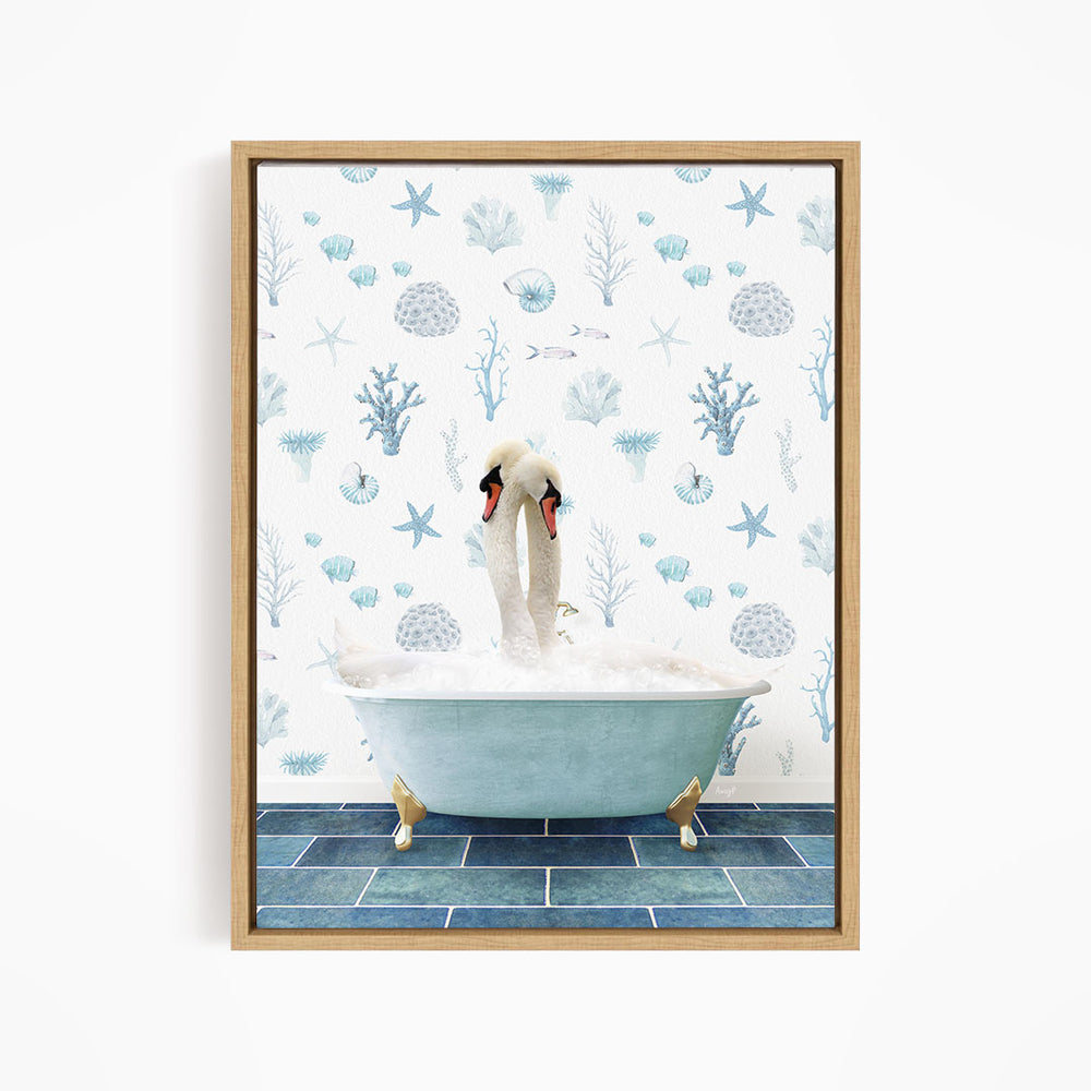 A framed image depicting a pair of swans sitting in a bathtub filled with bubbles, surrounded by a blue and white ocean-themed wallpaper.