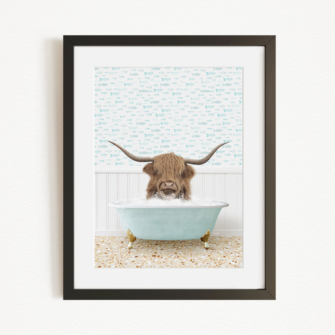 A framed image depicting a horned animal, likely a yak or a similar animal, sitting in a light blue bathtub filled with bubbles.
