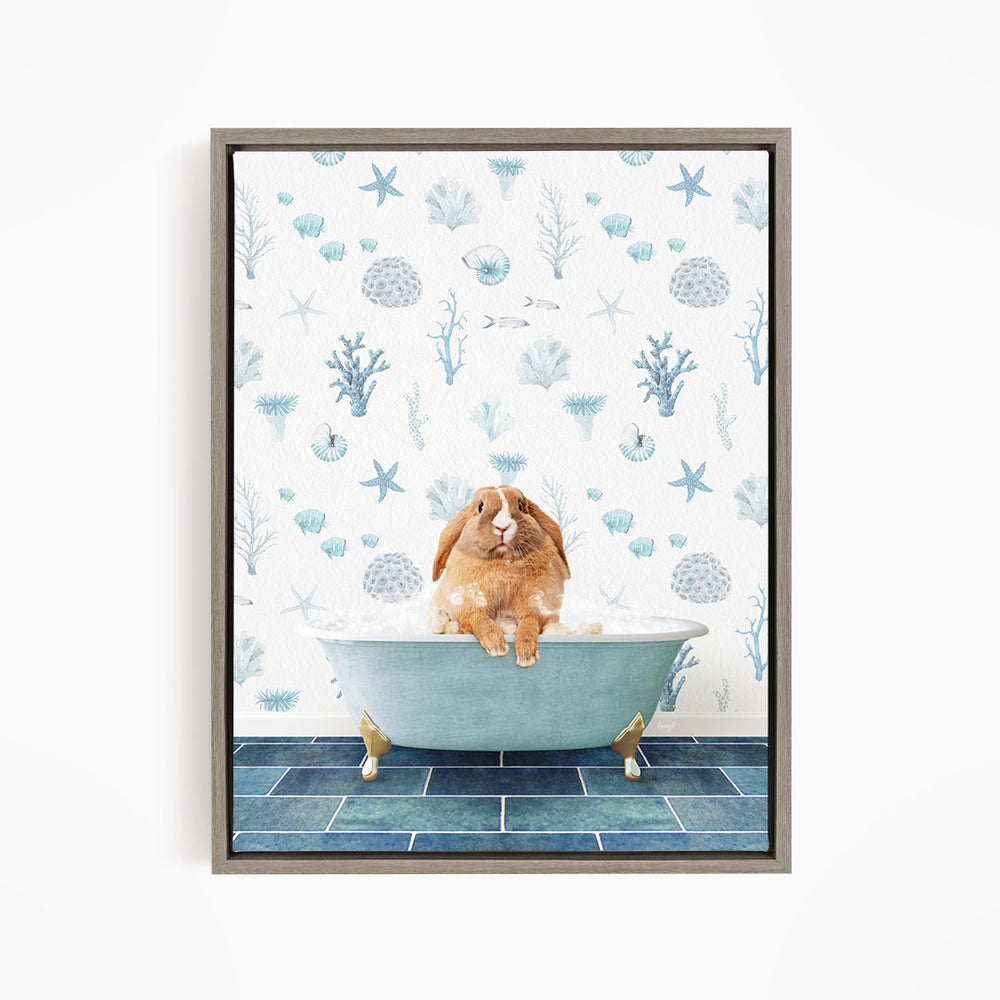 A brown rabbit sitting in a blue bathtub filled with bubbles, surrounded by a pattern of blue and white sea creatures and plants.