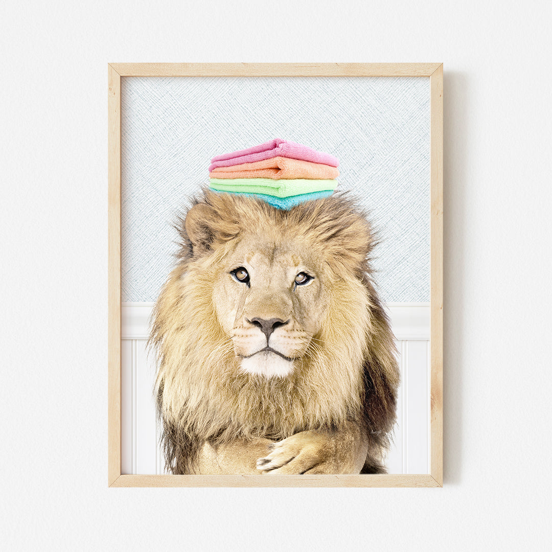 a picture of a lion with a pile of clothes on its head