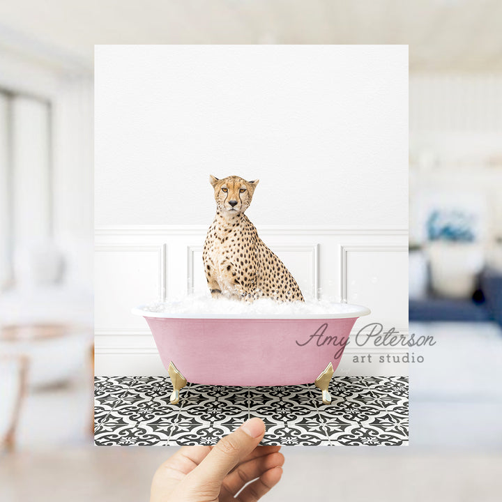 a cheetah sitting in a pink bath tub