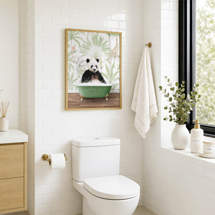 A bathroom with a white toilet, a framed picture of a panda sitting in a bathtub, and a window with greenery outside.