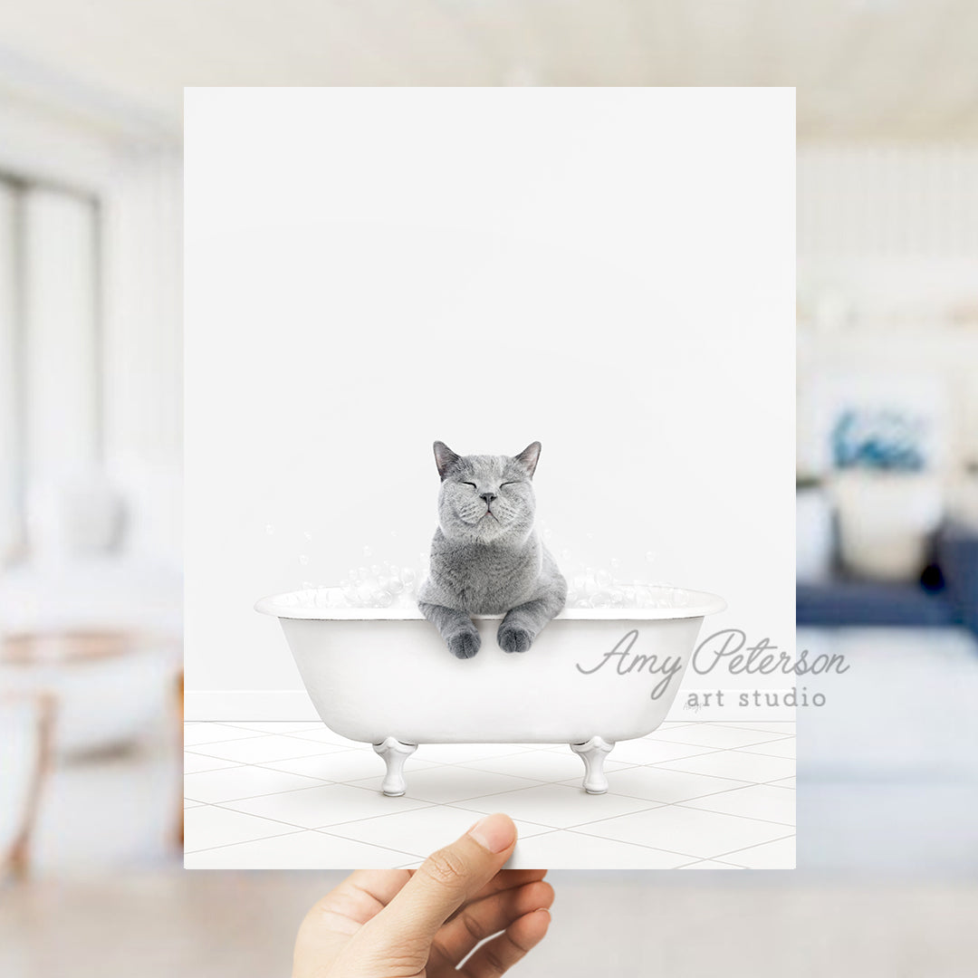 a person holding up a card with a cat in a bathtub