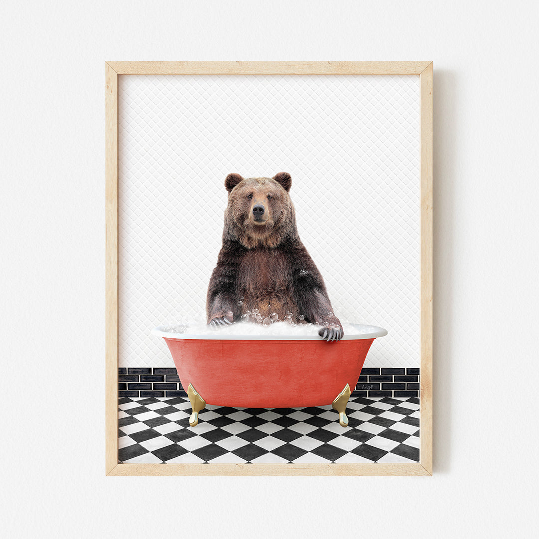 a brown bear sitting in a red bath tub