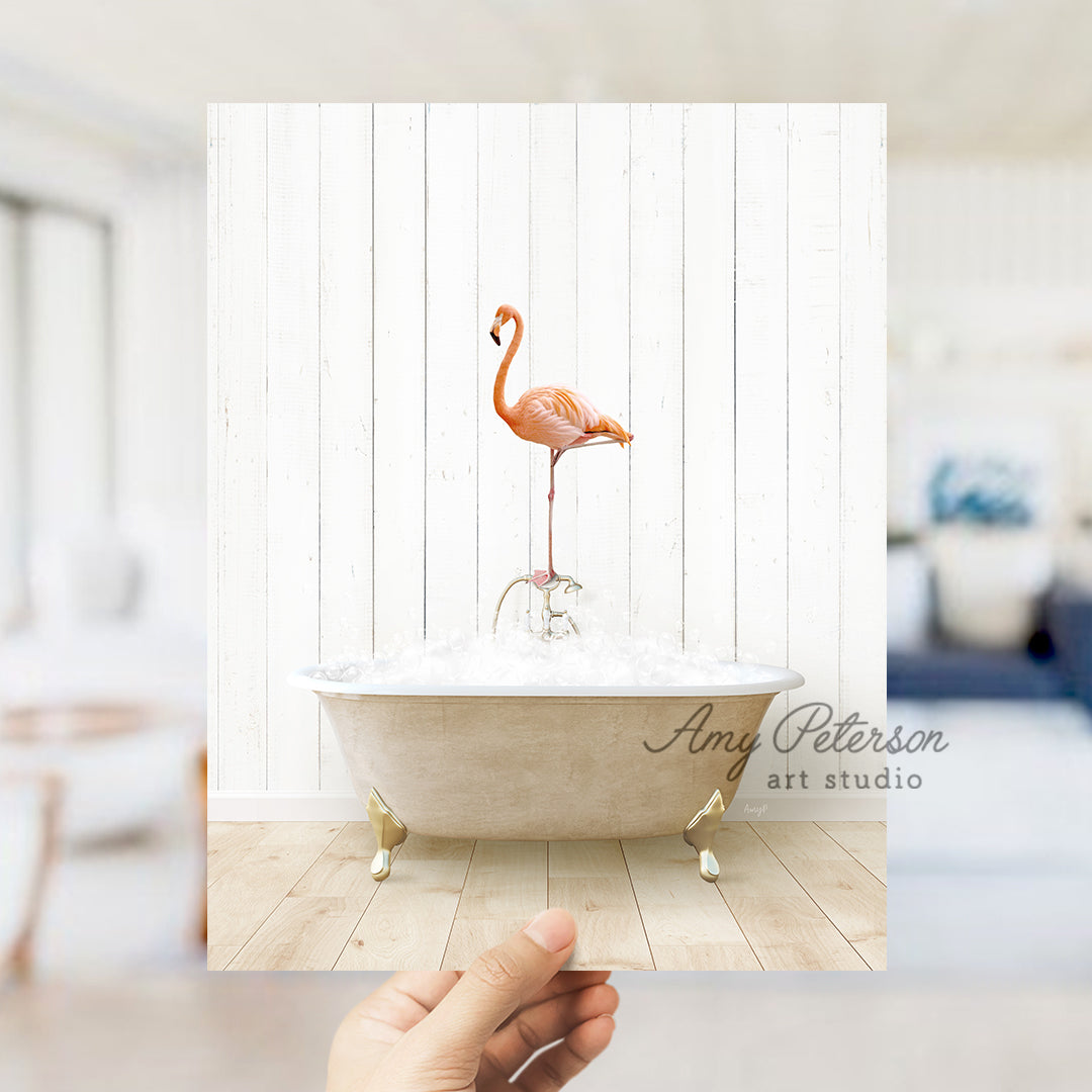 a pink flamingo standing on top of a bath tub