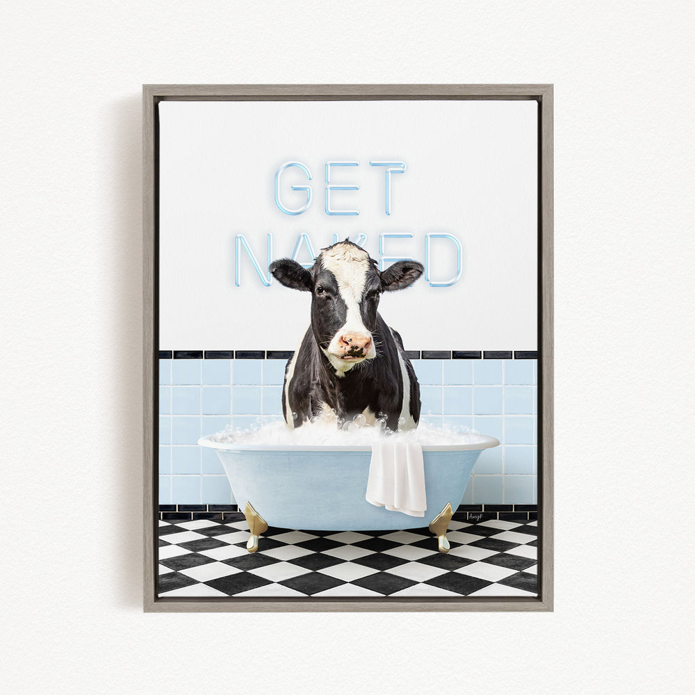 A black and white cow sitting in a bathtub filled with water, with the words "GET NANED" written on the wall behind it.