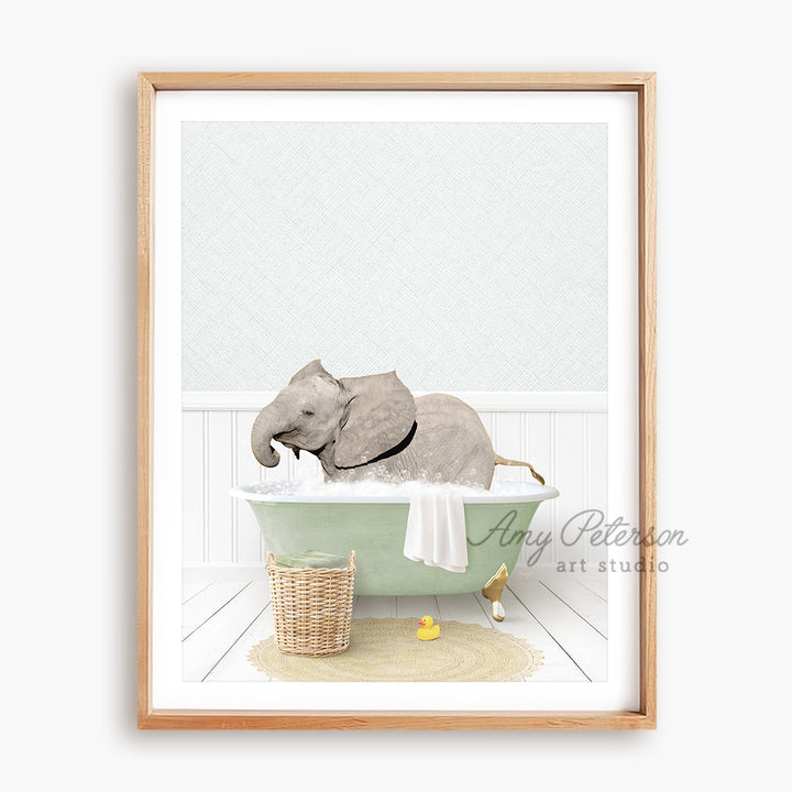 a picture of an elephant taking a bath