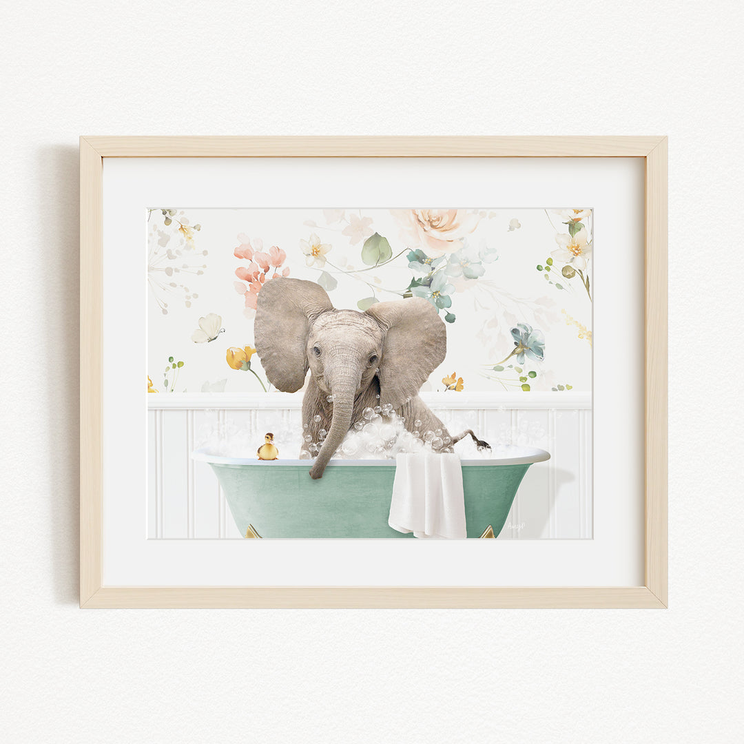 A baby elephant sitting in a green bathtub, surrounded by a floral background.