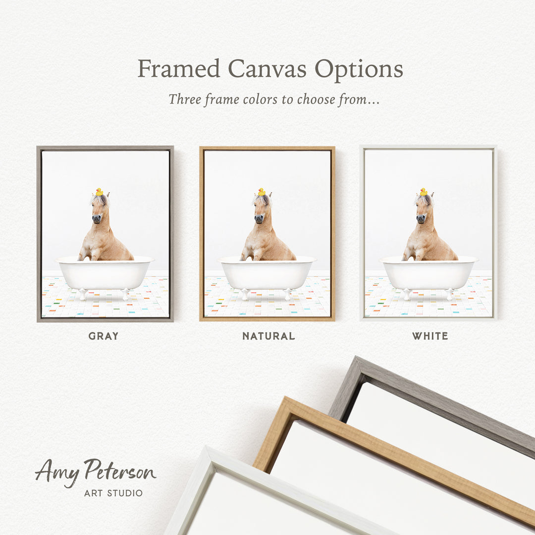 three framed canvas options, each featuring a brown horse sitting in a bathtub with a yellow hat on its head. The options include a gray, a natural, and a white frame.