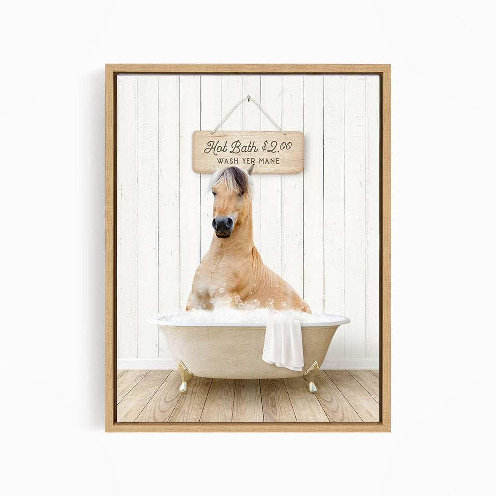 A brown horse is sitting in a white bathtub, with a wooden sign above it that reads "Hot Bath $2.00 WASH YE MANE".