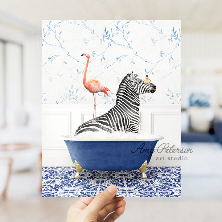 a hand holding a card with a zebra in a bathtub and a flamingo