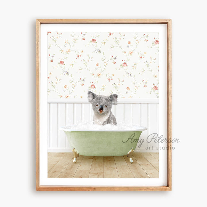 a framed picture of a koala in a bathtub