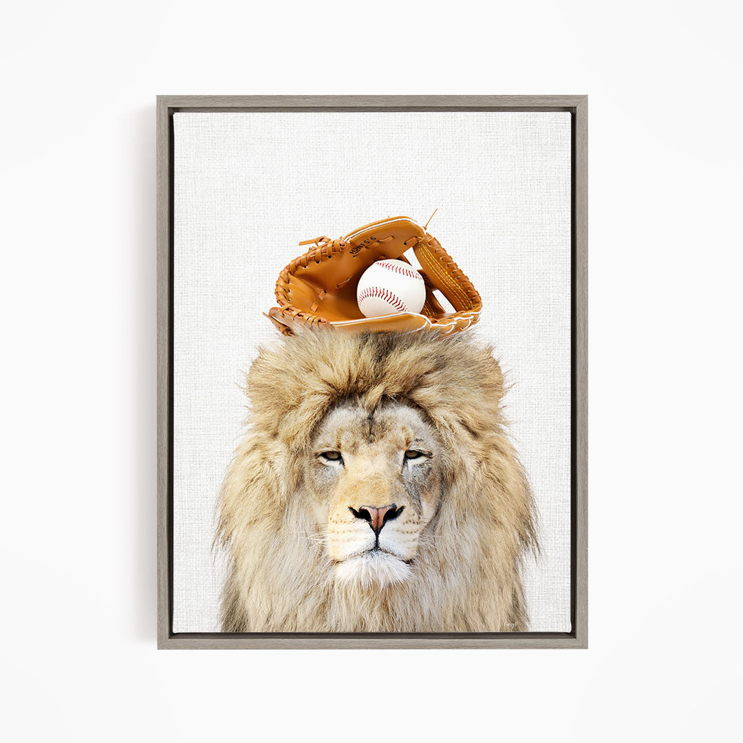 A lion wearing a baseball glove on its head, with a baseball resting on top of the glove.