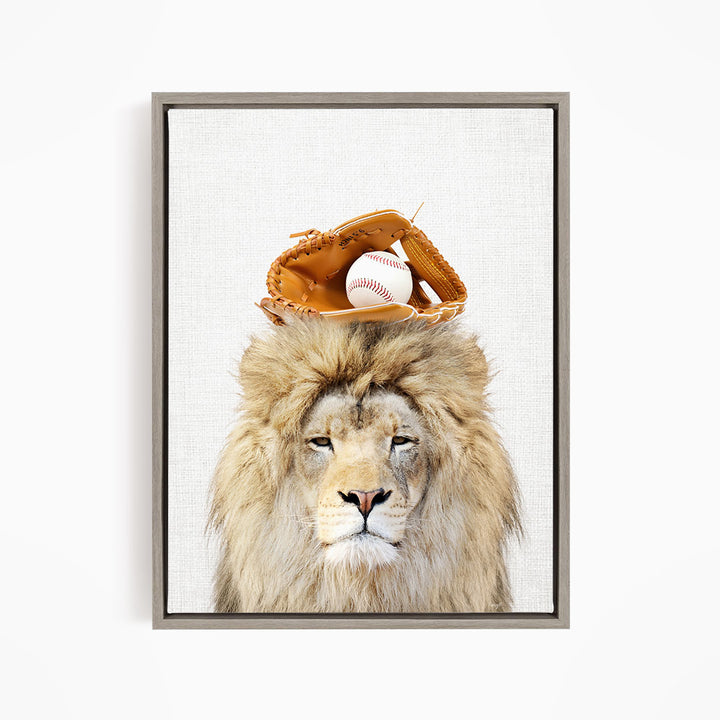A lion wearing a baseball glove on its head, with a baseball resting on top of the glove.