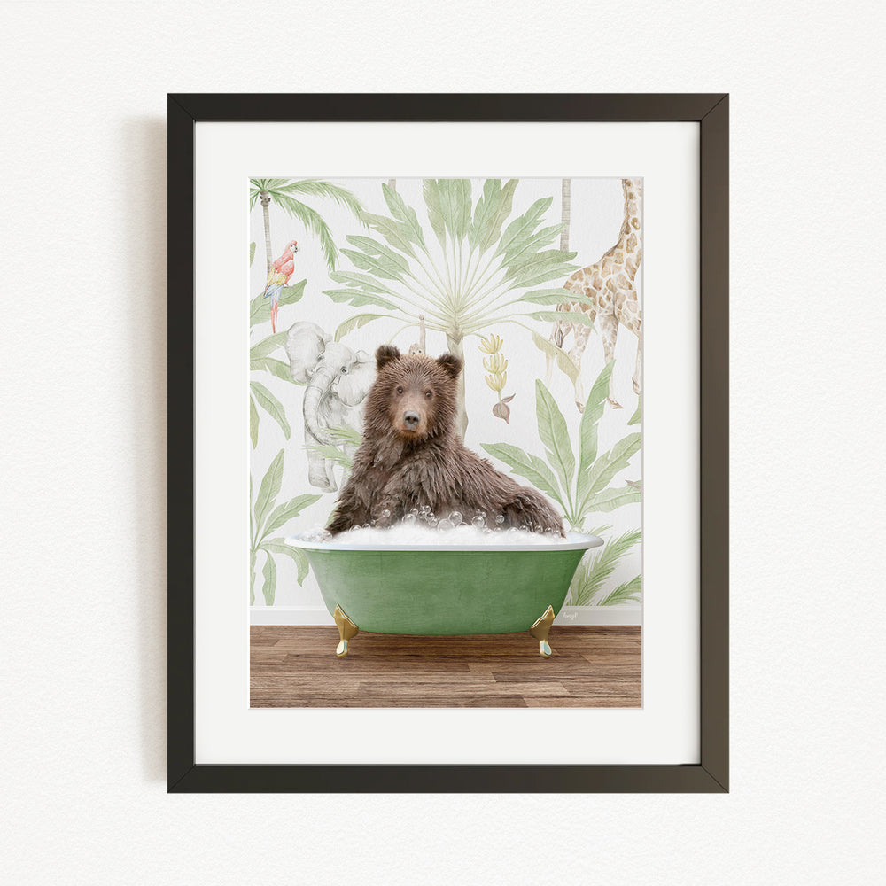 A brown bear is sitting in a green bathtub, surrounded by a tropical wallpaper with various animals, including a giraffe and an elephant.