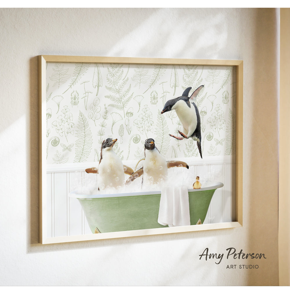 A framed image depicting three penguins sitting in a bathtub, with one penguin flying towards the others.