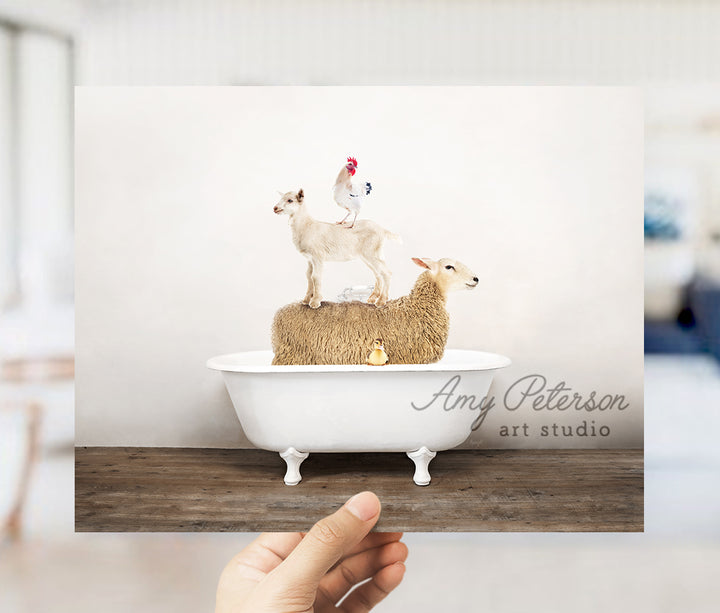 a person holding up a card with a picture of a sheep on top of a