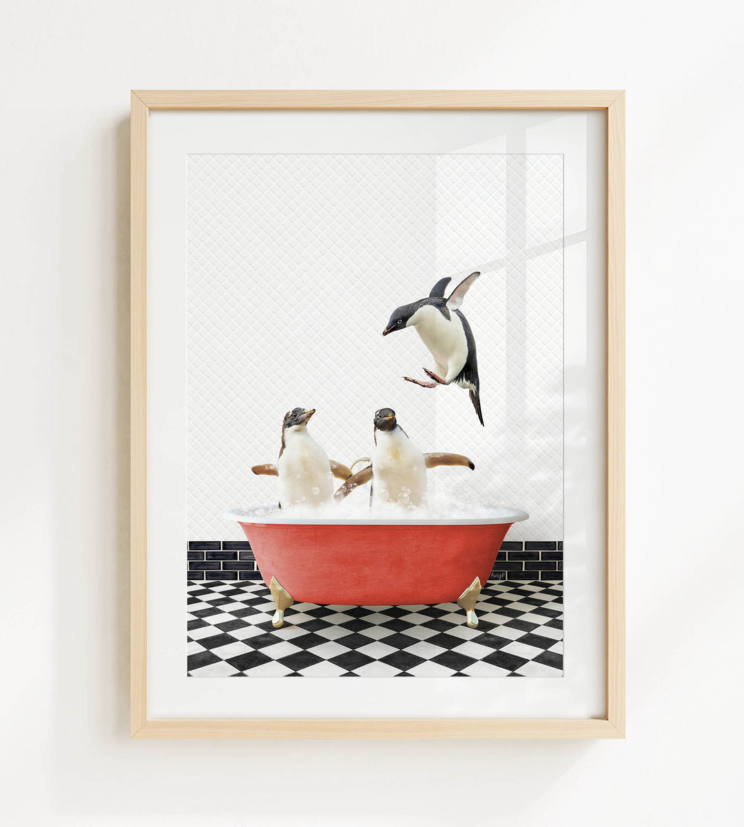 A framed image depicting three penguins sitting in a red bathtub, with one penguin flying out of the tub.