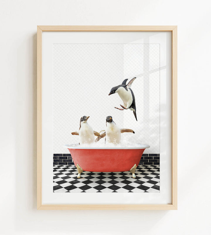 A framed image depicting three penguins sitting in a red bathtub, with one penguin flying out of the tub.