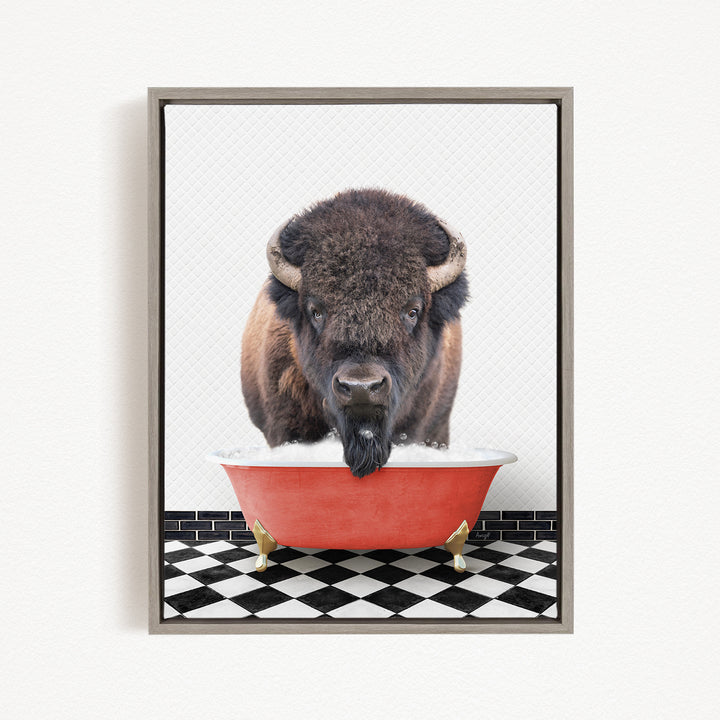 A buffalo with a long beard is standing in a red bathtub, looking directly at the camera.
