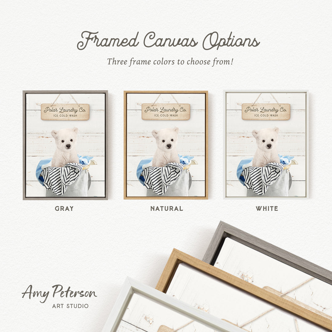 three framed canvas options for a Polar Laundry Co. product, featuring a white dog in a basket. The options include three different frame colors: gray, natural, and white.