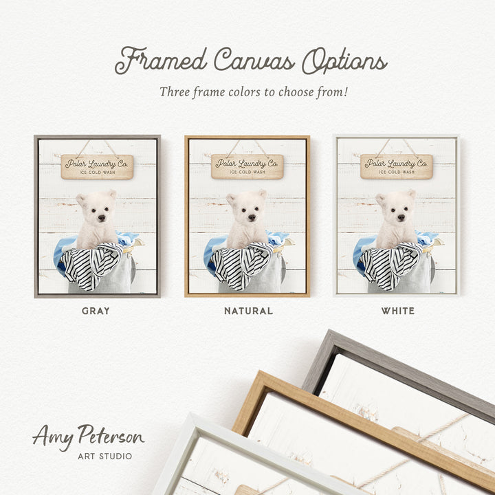 three framed canvas options for a Polar Laundry Co. product, featuring a white dog in a basket. The options include three different frame colors: gray, natural, and white.