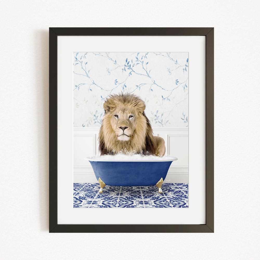 A lion sitting in a blue bathtub, surrounded by a blue and white floral patterned wall.