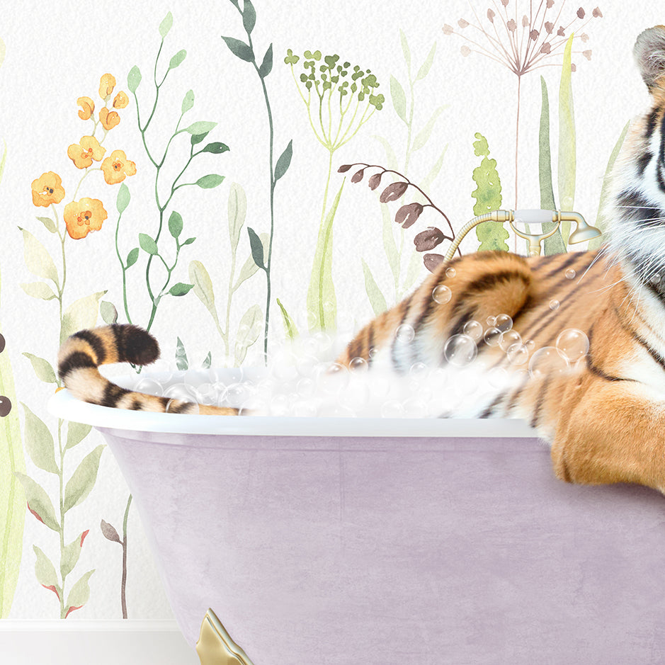 a stuffed tiger laying in a bath tub