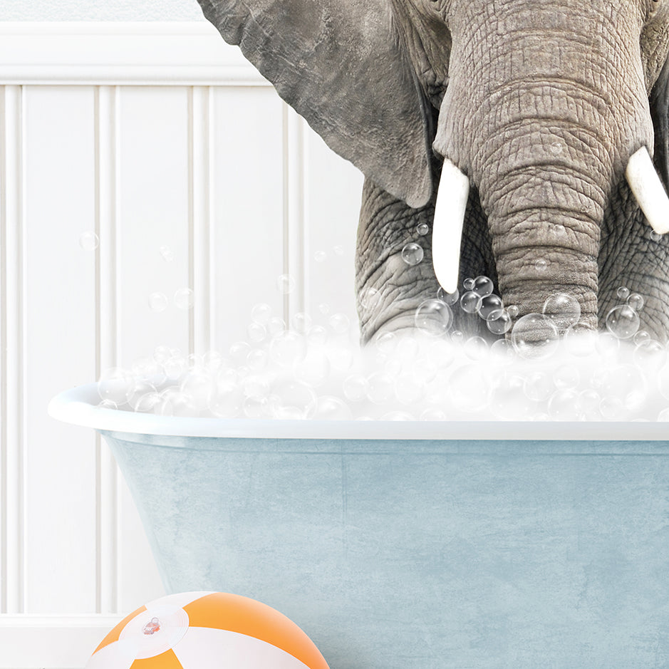 an elephant is taking a bath in a bathtub