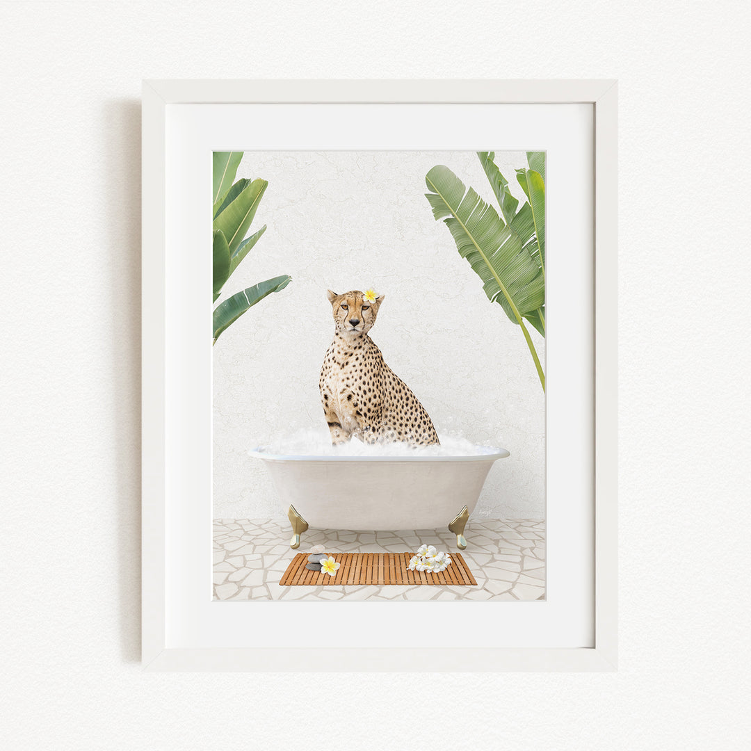 A cheetah sitting in a bathtub filled with water, surrounded by tropical plants and flowers.