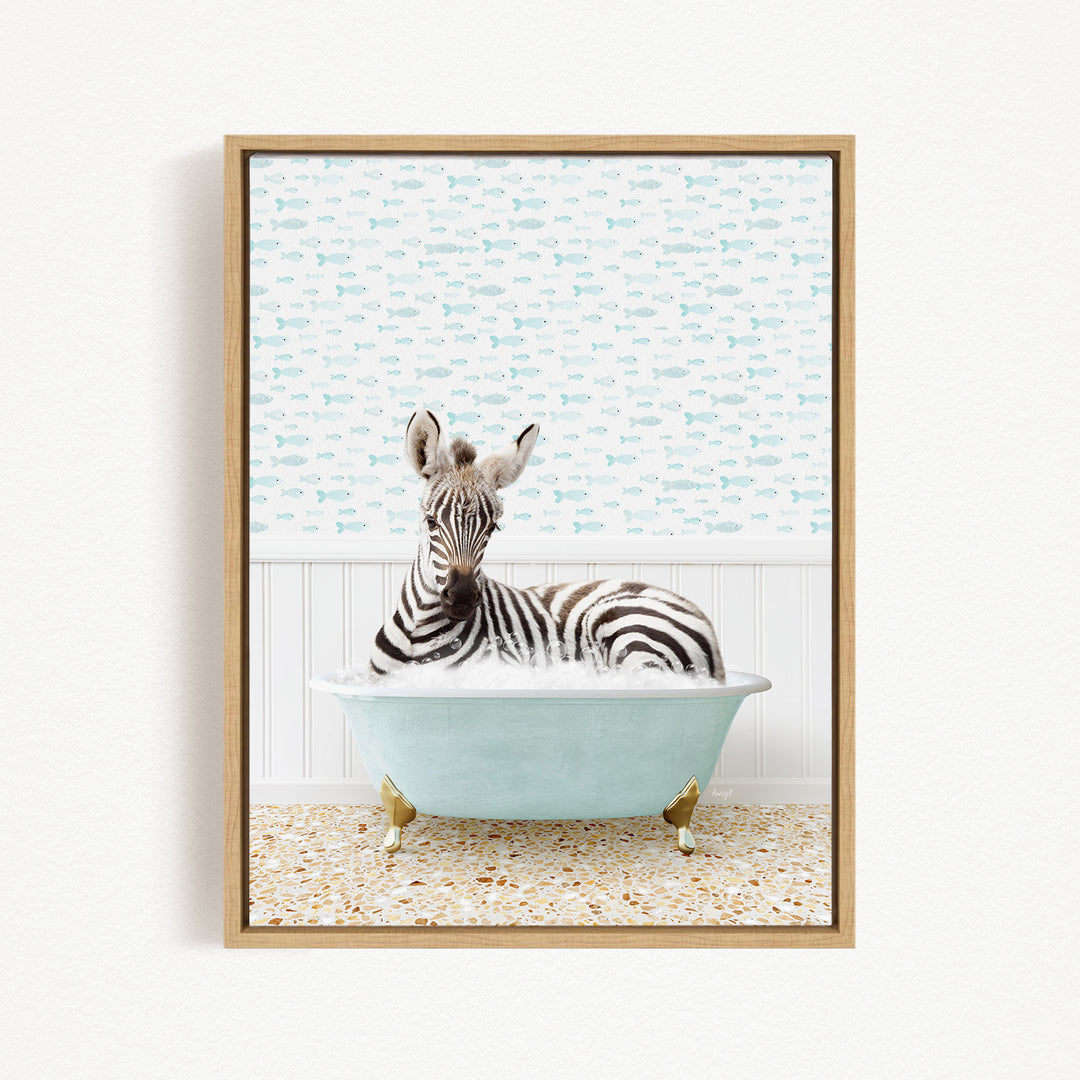 A zebra is sitting in a light blue bathtub, surrounded by a pattern of small fish.
