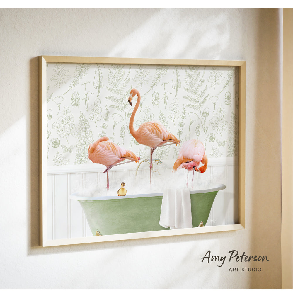 A framed print of a pink flamingo standing in a green bathtub, with a yellow rubber duck floating in the water.