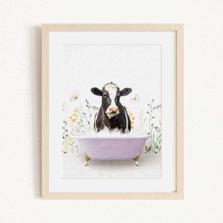 A black and white cow is sitting in a purple bathtub filled with bubbles, surrounded by flowers and butterflies.