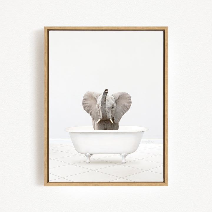A gray elephant is sitting in a white bathtub, with its trunk raised in the air.