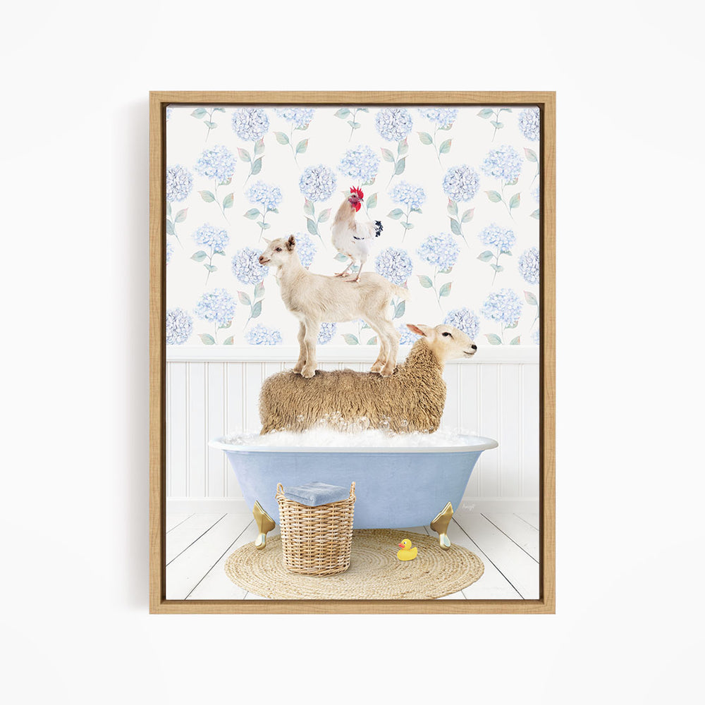A framed image depicting a sheep standing on a tub filled with bubbles, with a chicken perched on top of it, and a lamb sitting on the tub's edge.