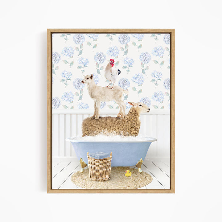 A framed image depicting a sheep standing on a tub filled with bubbles, with a chicken perched on top of it, and a lamb sitting on the tub's edge.
