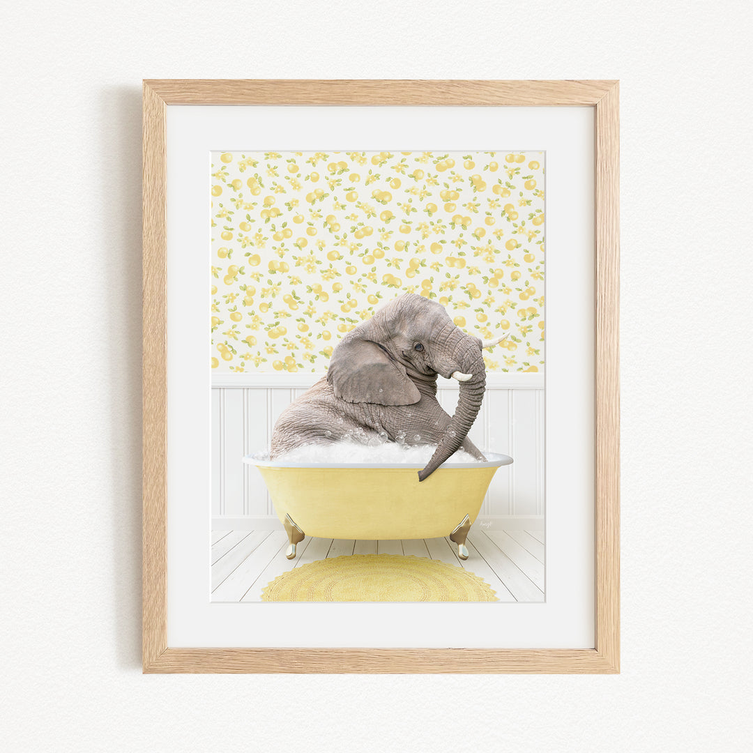 A gray elephant is sitting in a yellow bathtub, surrounded by a yellow and white floral pattern on the wall behind it.