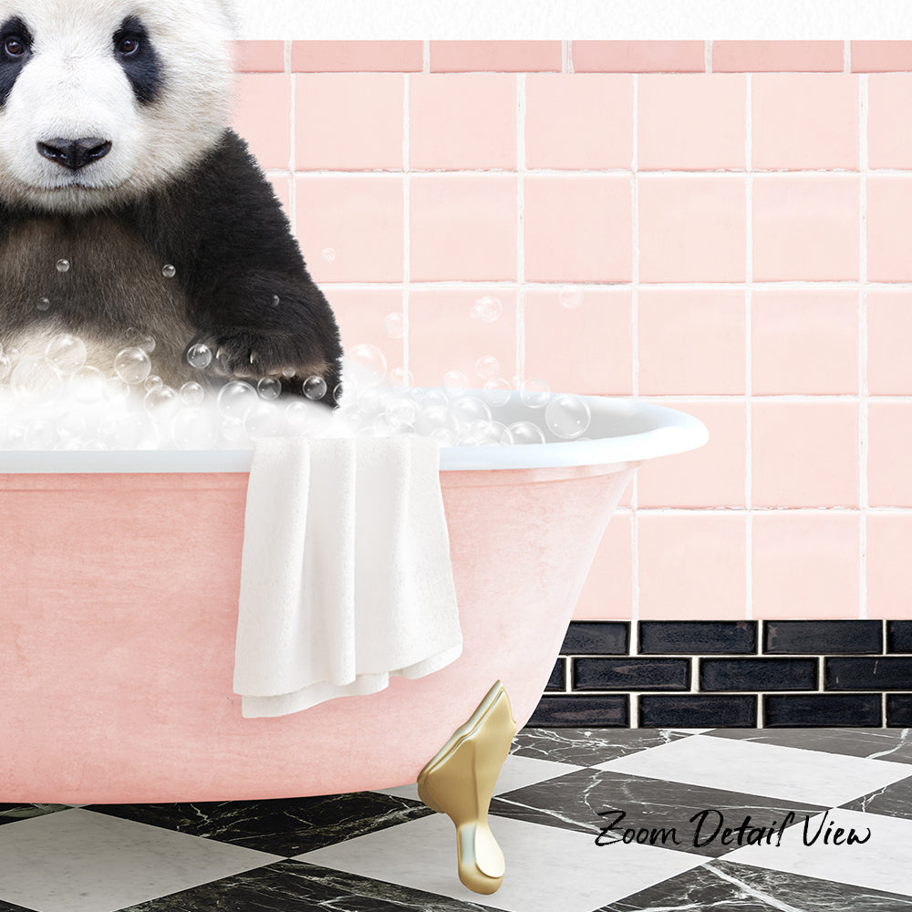 A panda bear sitting in a pink bathtub filled with bubbles, with a towel and gold bathtub leg visible.