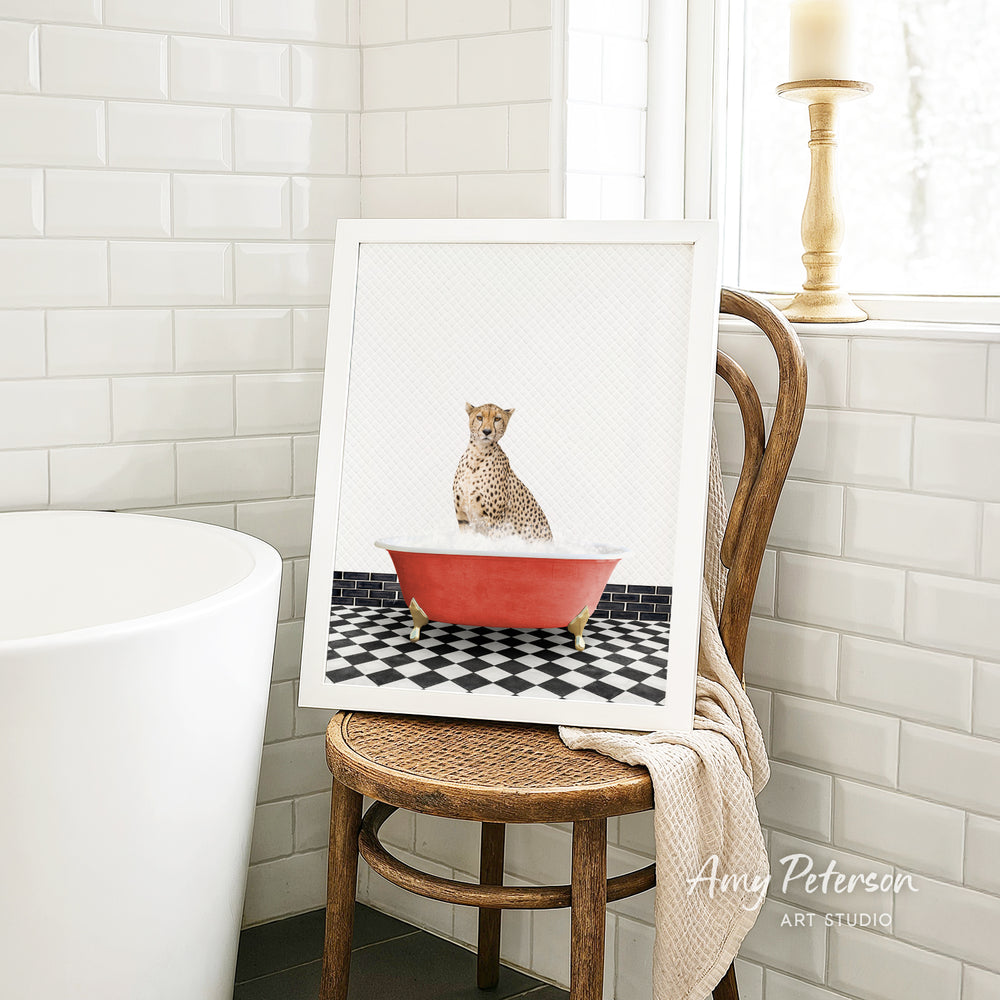 A cheetah sitting in a red bathtub with a black and white checkered floor, as depicted in a framed artwork.