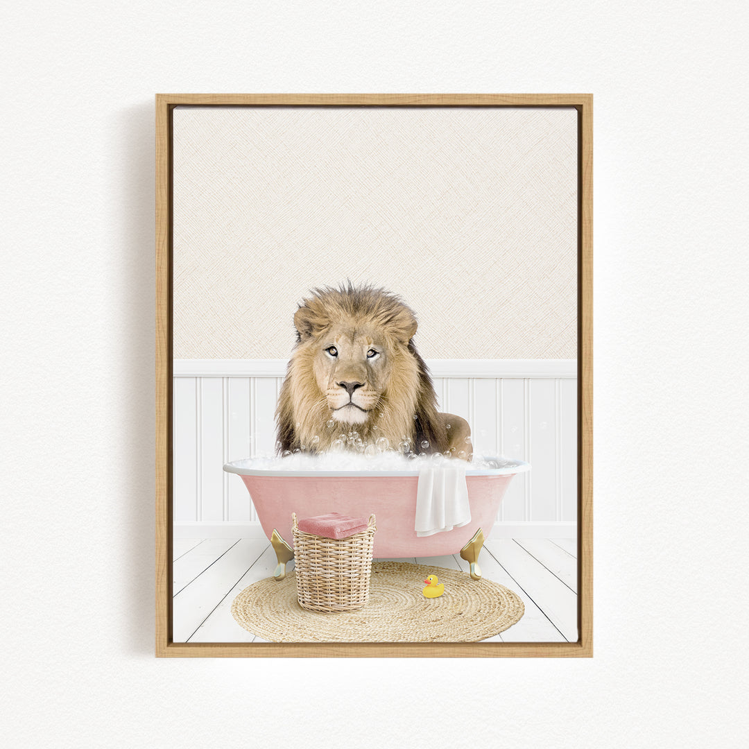 A lion sitting in a pink bathtub filled with bubbles, surrounded by a basket of toys and a yellow rubber duck.